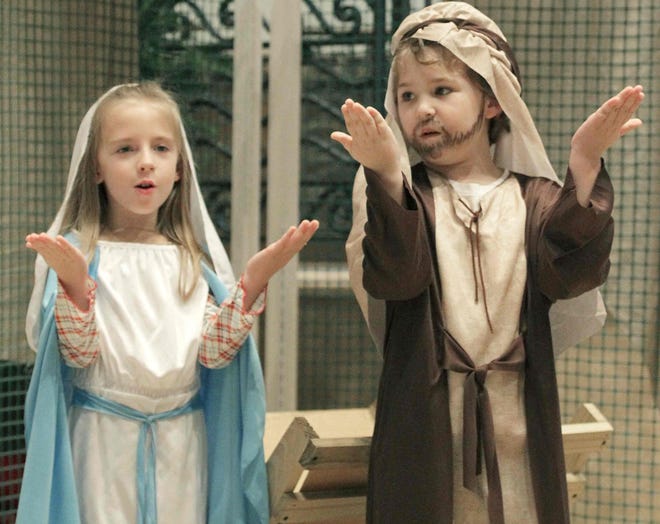 During the Christmas Eve Mass in 2014 at Blessed Trinity Catholic Church in Ocala, youngsters Camryn Westgate and Peyton Greenbaum portrayed Mary and Joseph . A number of holiday services are planned this year. [Bruce Ackerman/Star-Banner file photo]