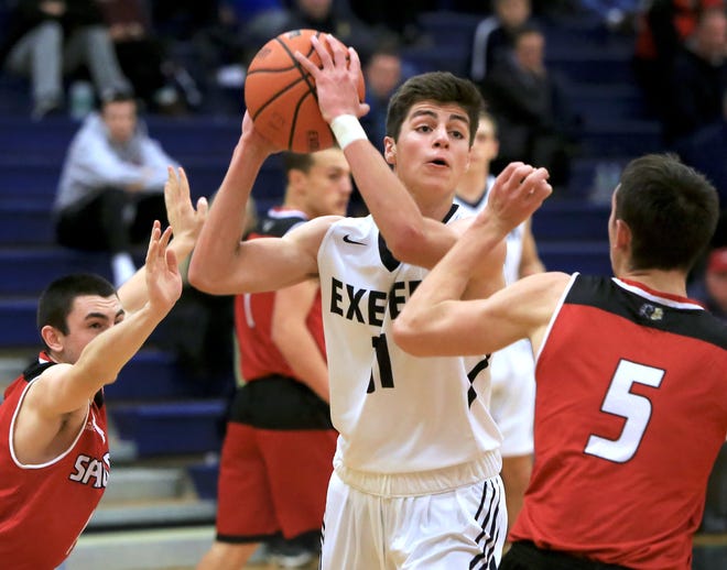 Exeter's Ryan Grijalva looks for an open teammate during last Friday night's Division I boys basketball game against Spaulding.

[Ioanna Raptis/Seacoastonline]