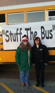 Wanda Parent, left, is the director of the "Stuff the Bus" campaign in Sanford and is one of York County Coast Star's Christmas Angels this holiday season. She is seen here with Sheila Beckworth-Hibbard, of Ledgemere, the bus company that donates the buses that Parent's program uses.

[Courtesy photo]