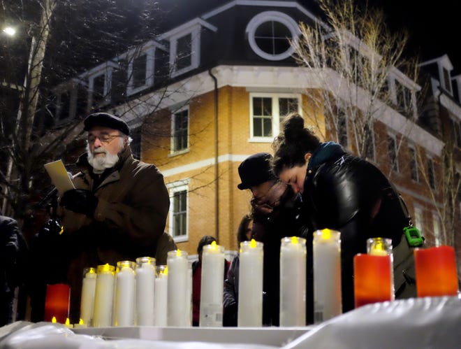 Rev. Vivan Martindale gives a blessing during the Homeless Memorial Candlelight Vigil Thursday night hosted by Cross Roads House and Families First in memory of the homeless individuals who have died over the past year.

[Ioanna Raptis/Seacoastonline]