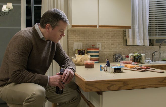 Matt Damon plays Paul Safranek and Jason Sudeikis is old friend Dave Johnson, in "Downsizing," a movie in which people agree to be miniaturized in order to form a world with less strain on the ecology. [Paramount Pictures]