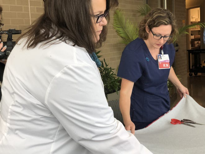 On Giving Tuesday, Nov. 28, nurses in in SwedishAmerican’s Cardiac Surveillance Unit made holiday-themed fleece blankets for their heart patients. [PHOTO PROVIDED]