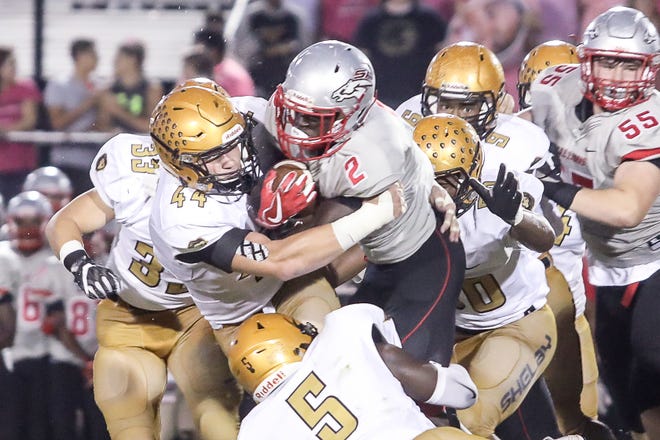 Shelby High linebacker Dax Hollifield, 44, leads the defense on a stop earlier this season. The Golden Lion senior was voted The Associated Press' 2017 Defensive Player of the Year for North Carolina on Thursday. [David Grose/Special to The Star]