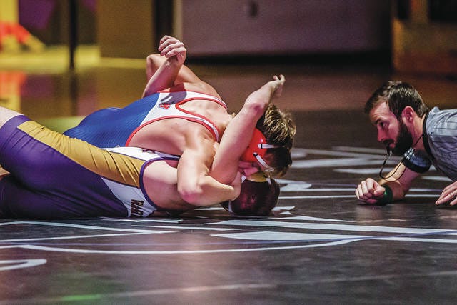 Ballard’s Gerald Gute scored a fall over Norwalk’s Trey Wulf in 23 seconds at 160 pounds during the Bombers’ dual with the Warriors Dec. 12 at Norwalk. Photo by Missy Miller.