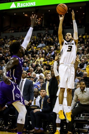 Missouri guard Kassius Robertson rises up for a 3-pointer during the Tigers' 82-81 win over Stephen F. Austin on Tuesday at Mizzou Arena. Robertson is currently leading the team with 14.5 points per game and is shooting 42 percent from deep. [Hunter Dyke/Tribune]