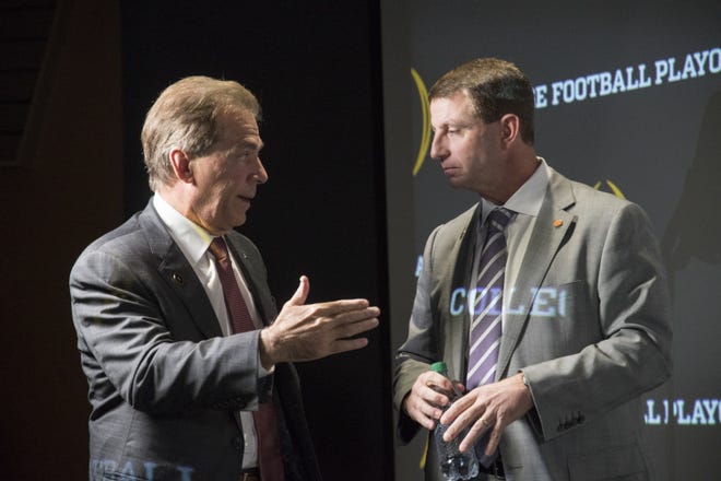 Alabama's Nick Saban, left, and Clemson’s Dabo Swinney have helped to build the two premier programs in college football. [FILE/AP]