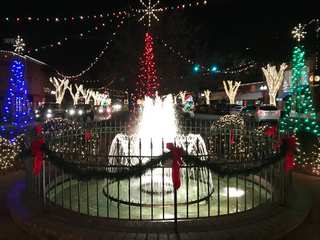 Holiday lights surround a fountain on Main Street in Forest City. [Wade Allen/The Star]