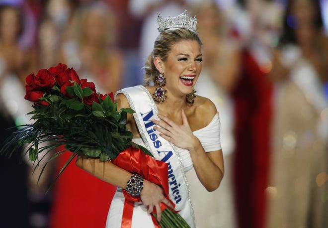 FILE - In this Jan. 12, 2013 file photo, Miss New York Mallory Hytes Hagan reacts as she is crowned Miss America 2013 in Las Vegas. Some former Miss Americas shamed in emails from the pageant’s CEO are calling on him and other leaders of the Miss America Organization to resign. Hagan’s appearance and sexual habits were mocked in the emails.  (AP Photo/Isaac Brekken, File)