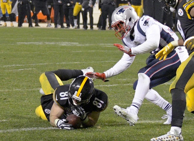 In this Sunday, Dec. 17 file photo, Pittsburgh Steelers tight end Jesse James (81) loses his grip on the football after crossing the goal line on a pass play against the New England Patriots in the closing seconds of the fourth quarter of an NFL football game in Pittsburgh. While coaches, players, fans and broadcasters become puzzled or annoyed by the NFL's "catch rule," the people in charge of developing and refining it through the years also have struggled. [DON WRIGHT / ASSOCIATED PRESS]