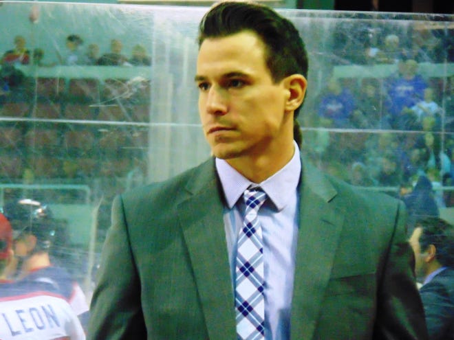DAVE EMINIAN/JOURNAL STAR Former Rivermen captain Dan Bremner, in his second game as head coach for SPHL Roanoke, on the bench at Carver Arena during Saturday's game against the Rivermen.