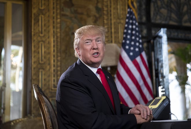 President Donald Trump turns to talk to the gathered media during a Christmas Eve video teleconference with members of the mIlitary at his Mar-a-Lago estate in Palm Beach, Fla., on Sunday. [AP Photo/Carolyn Kaster]