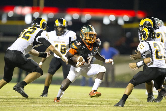 Mosley's John "Tank" Miller (3) runs against Rutherford in a game last season. Miller has been named the News Herald's Bay County Offensive Player of the Year for 2017. [JOSHUA BOUCHER/THE NEWS HERALD]