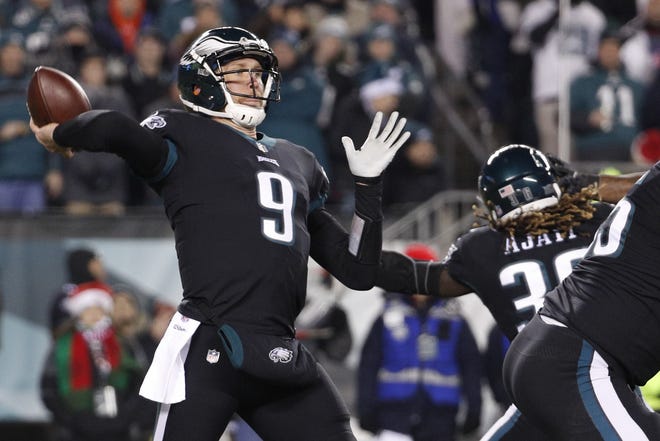 Eagles quarterback Nick Foles looks downfield during the first quarter of Monday night's game against the Raiders at the Linc. [Chris Szagola/Associated Press]