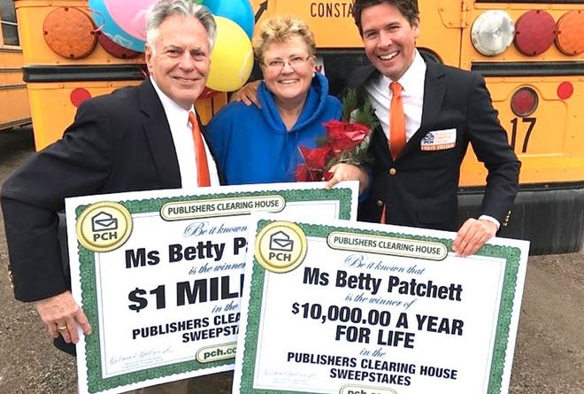 Publishers Clearing House Prize Patrol members Dave Sayer and Howie Guja present Betty Patchett of Constantine with the PCH “SuperPrize.”