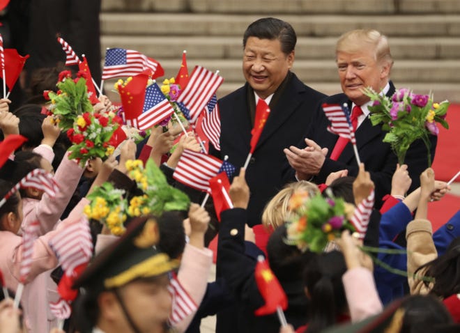 FILE - In this Nov. 9, 2017, file photo, President Donald Trump and Chinese President Xi Jinping participate in a welcome ceremony at the Great Hall of the People in Beijing, China. Trump couldnt seem to stop talking about the red carpets, military parades and fancy dinners that were lavished upon him during state visits on his recent tour of Asia. Magnificent, he declared at one point on the trip.
But Trump has yet to reciprocate in kind. In fact, he is the first president in decades to close his first year in office without welcoming a counterpart on a visit to the U.S. with similar trappings. (AP Photo/Andrew Harnik, File)