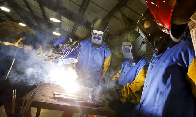 Residents learn to weld at the Tuscaloosa Juvenile Detention Center on Tuesday. The facility is conducting a fund raising drive to expand the facility and include permanent welding booths to help more of the youngsters learn the trade. [Staff Photo/Gary Cosby Jr.]