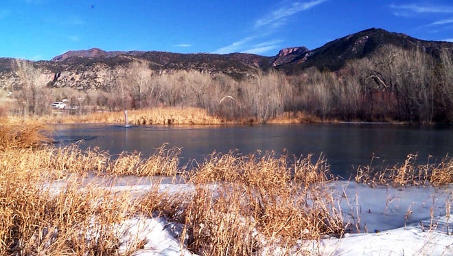 A pond in New Harmony, Utah, is shown on Tuesday, Dec. 26, 2017, after an 8-year-old boy fell into it and was rescued on Monday. Authorities have not offered details about the boy’s condition but Washington County sheriff’s Sgt. Aaron Thompson said at a news conference Tuesday that deputies were hopeful for the boy. (Alex Cabrero/The Deseret News via AP)