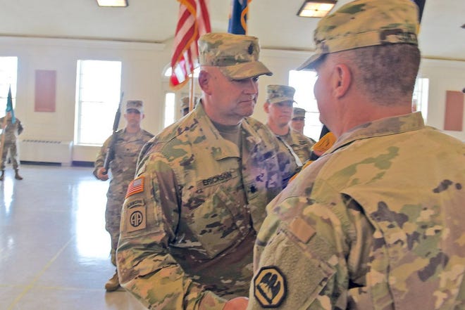 Louisiana National Guard Lt. Col. Dirk Erickson takes the 61st Troop Command colors from Maj. Gen. Glenn H. Curtis, the adjutant general of the LANG, during an official change of command ceremony at the Gillis W. Long Center in Carville, Louisiana, Nov. 2, 2017. Erickson assumed command from Col. Johnathon W. Ballard, who commanded the 61st for over five years.