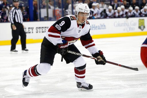 File- This Dec. 9, 2017, file photo shows Arizona Coyotes' Clayton Keller playing against the Columbus Blue Jackets during an NHL hockey game in Columbus, Ohio. Keller got his rookie season off to a stellar start, hit a bit of a speed bump and has started created scoring opportunities again. He is one of several rookies who have had a big impact on their teams the first three months of the season. (AP Photo/Jay LaPrete, File)