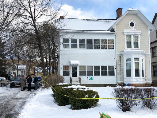 Police secure the perimeter of a home in Troy, N.Y., Tuesday, Dec. 26, 2017, after four bodies were discovered in a basement apartment. Troy police say the deaths are being treated as suspicious.
(Nicholas Buonanno/The Record via AP)
