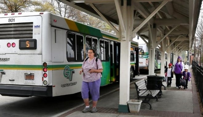 A Gastonia Transit bus stops to pick up passengers at the Bradley Station downtown on a recent weekday morning. [John Clark/The Gaston Gazette]