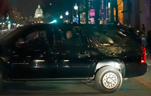 FILE - In this March 25, 2017, file photo, President Donald Trump and his motorcade turns onto Pennsylvania Avenue as he returns to the White House after dinner at the Trump International Hotel in Washington. He's been in Washington for almost a year. Yet in all that time, Trump has yet to enjoy a single nonworking meal at a restaurant that doesn't pay him rent. He hasn't taken in a performance at the Kennedy Center; hasn't been to a Nationals game; hasn't toured the sites. (AP Photo/Alex Brandon, File)