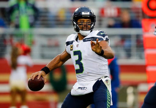 FILE - In this Nov. 26, 2017, file photo, Seattle Seahawks quarterback Russell Wilson (3) throws against the San Francisco 49ers during the first half of an NFL football game in Santa Clara, Calif. Wilson is the primary offensive reason why Seattle has playoff hopes going into the regular season finale against the Arizona Cardinals. (AP Photo/John Hefti, File)