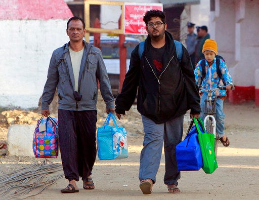 Local interpreter Aung Naing Soe, right, and driver Hla Tin, left, walk out as they were released from Yamethin prison Friday, Dec. 29, 2017, in Yamethin township, on the outskirts of Naypyitaw, Myanmar. Two journalists and 
The two local staff and two journalists were released from a Myanmar prison Friday, two months after their arrest for allegedly flying a drone over the parliament. (AP Photo)