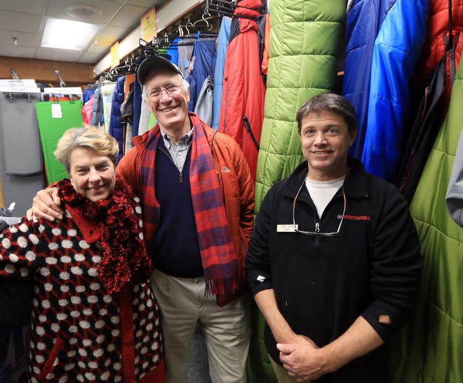 Ann and Peter Tarlton, left, gather donations from fellow St. John's parishioners, to provide sub-zero sleeping bags for the homeless with help of Jeff Irish, assistant manager in the Kittery Trading Post camping department. [Ioanna Raptis/Seacoastonline]