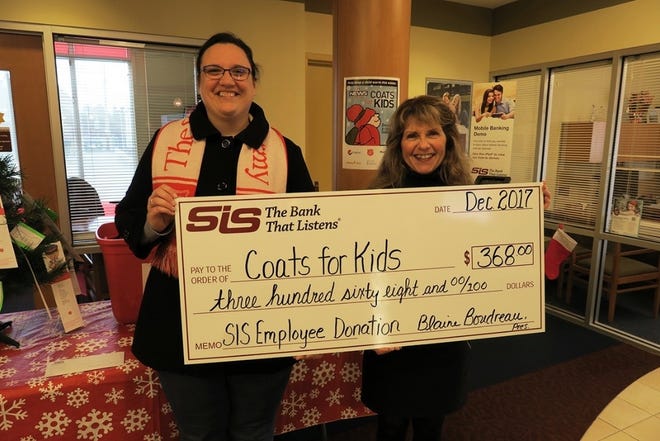 Linda Nadeau (right), SIS Bank’s assistant to senior management, presents Erin Smullen (left) of the Sanford Salvation Army with a check for $368 raised from bank employees during the recent “Casual for a Cause” day. The money will go toward the purchase of winter coats, hats and mittens to accompany those collected during the Coats for Kids drive.

[Courtesy photo]