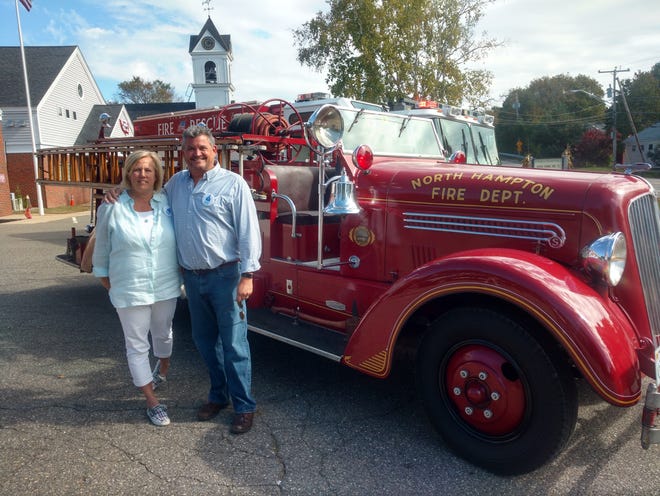 Kathy and Wally Kilgore check out the 1937 fire department truck during North Hampton’s 275th anniversary celebration. [Jesse Migneault photo]