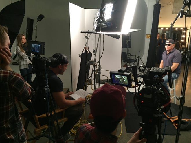 Filmmaker Ben Patterson (seated center) interviewing Steve Madden (in sunglasses) for "Maddman."
