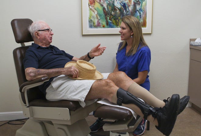 Herbert Horowitz, 99, talks with Dr. Alissa Zdancewicz, a Sarasota podiatrist at West Coast Podiatry. [HERALD-TRIBUNE ARCHIVE]