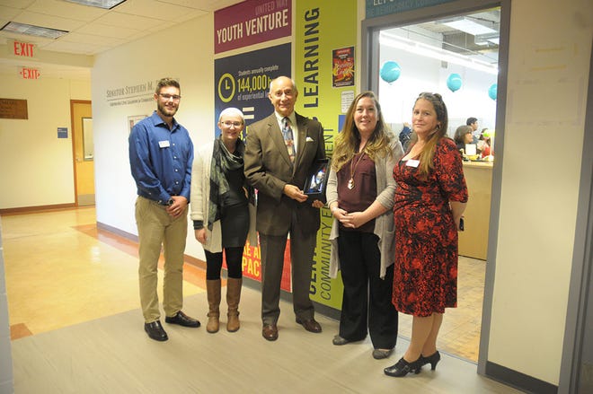 Mount Wachusett Community College President Emeritus Daniel M. Asquino, center, stands outside the Brewer Center at MWCC's Gardner campus with Student Leaders in Civic Engagement Jake VanHillo and Laryssa Truesdale, Assistant Dean, K-12 Partnerships and Civic Engagement Fagan Forhan, and Student Leaders in Civic Engagement after receiving a national civic leadership award named in his honor. SUBMITTED PHOTO