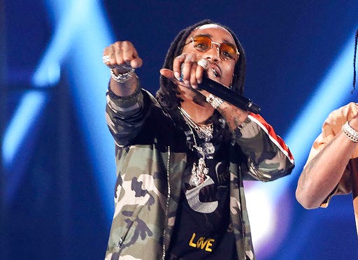 FILE - In this Saturday, Sept. 23, 2017, file photo, Quavo performs with Travis Scott and DJ Khaled at the 2017 iHeartRadio Music Festival Day 2 held at T-Mobile Arena on in Las Vegas. Quavo of the Grammy-nominated rap group Migos had some fun on social media after it was pointed out that he once held a high school football record that Houston Texans backup quarterback Taylor Heinicke eventually outdid. (Photo by John Salangsang/Invision/AP, File)