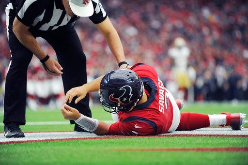 FILE - In this Sunday, Dec. 10, 2017, file photo, Houston Texans quarterback Tom Savage (3) is checked by a referee after he was hit during the first half of an NFL football game against the San Francisco 49ers, in Houston. Savage left the game and it was later determined he had a concussion. On Friday, Dec. 29, 2017, the NFL announced a series of changes to the way possible concussions are handled during games following the incident in which Savage was allowed to return to the field after a hit left him on the ground, arms shaking. (AP Photo/Eric Christian Smith, File)
