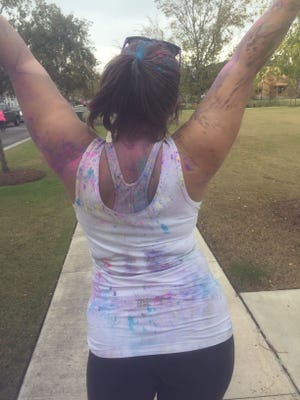 Katie Landeck, finishing the Color Vibe 5K last year, which was one of "our" New Year's Resolutions. [ERYN DION/THE NEWS HERALD]