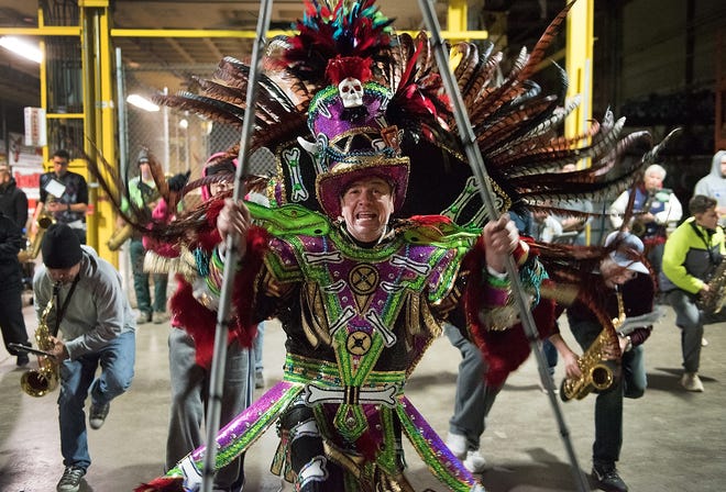 Uptown String Band Captain Jamie Caldwell, dressed as a voodoo chief, practices with the band inside a warehouse in Falls on Thursday, Dec. 28, 2017. [BILL FRASER / STAFF PHOTOJOURNALIST]