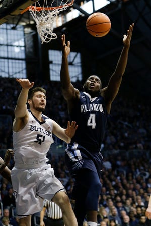 Villanova's Eric Paschall goes for a rebound in front of Butler center Nate Fowler during Saturday's game. [AJ MAST / THE ASSOCIATED PRESS]