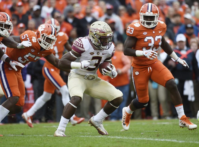 Clemson linebacker J.D. Davis (33) chases down Florida State running back Cam Akers during their game on Nov. 11 at Clemson. Davis led the team with eight tackles in the victory. [FILE/AP]
