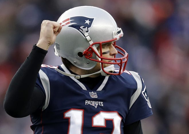 Patriots quarterback Tom Brady has had many reasons to celebrate this season and is now a front-runner for the league's MVP award. [AP Photo/Charles Krupa]