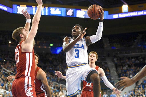 UCLA's Aaron Holiday (3) drives to the basket against Washington State during the first half of an NCAA college basketball game Friday, Dec. 29, 2017, in Los Angeles. (AP Photo/Michael Owen Baker)