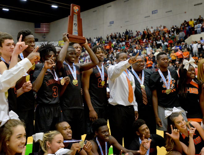 Leesburg celebrates after winning the Class 6A state finals at The Lakeland Center on March 4 in Lakeland. Leesburg beat Cape Coral Mariner 57-53 for the title. [DAILY COMMERCIAL FILE]