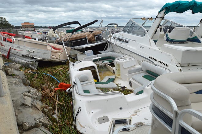 Boats and docks were piled on one another at the Tavares Seaplane Base docks during Hurricane Irma on Sept. 11 in Tavares. [WHITNEY LEHNECKER / DAILY COMMERCIAL]