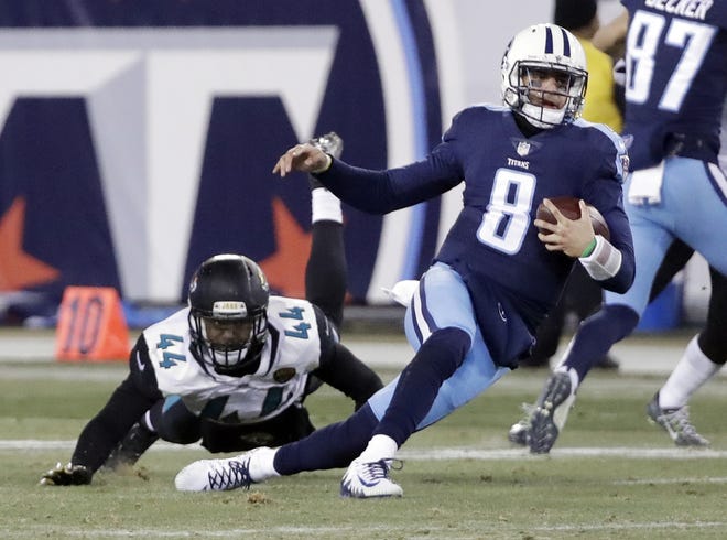 Tennessee Titans quarterback Marcus Mariota (8) is brought down by Jacksonville Jaguars outside linebacker Myles Jack (44) in the second half of an NFL football game Sunday, Dec. 31, 2017, in Nashville, Tenn. (AP Photo/James Kenney)