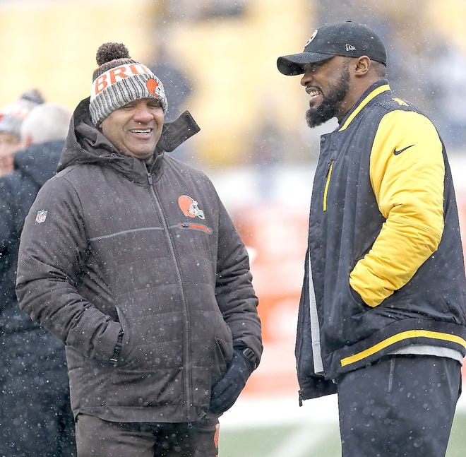 Cleveland Browns coach Hue Jackson and Pittsburgh Steelers coach Mike Tomlin (from left) visit on the field during warmups before Sunday's game in Pittsburgh.    

[Keith Srakocic / Associated Press]