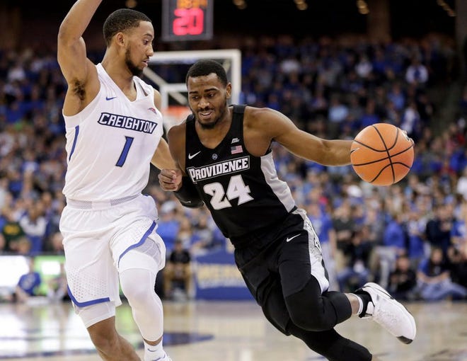 Kyron Cartwright, driving past Creighton's Davion Mintz in the first half on Sunday, played only seven minutes in the second half because of a sore ankle.