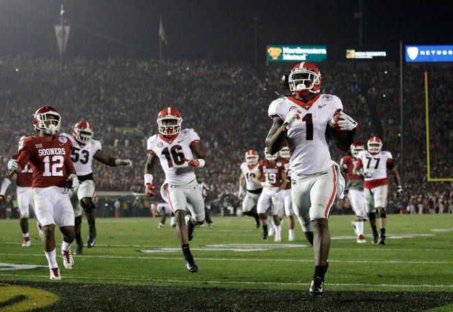 Georgia running back Sony Michel (1) scores a touchdown in the second overtime against Oklahoma in the Rose Bowl on Monday in Pasadena, Calif. Georgia won 54-48. (AP Photo/Jae C. Hong)