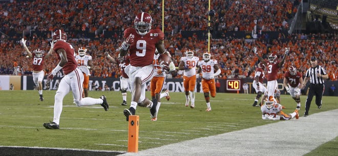 Alabama running back Bo Scarbrough (9) leaps into the end zone for his second touchdown of the first half during the College Football Playoff National Championship game in Raymond James Stadium in Tampa Monday, January 9, 2017. Staff Photo/Gary Cosby Jr.