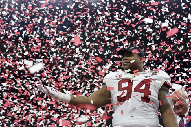 Alabama defensive lineman Da'Ron Payne (94) celebrates after being selected most valuable defensive player after the Sugar Bowl semifinal playoff game against Clemson on Monday in New Orleans. Alabama won 24-6 to advance to the national championship game. [AP Photo / Rusty Costanza]